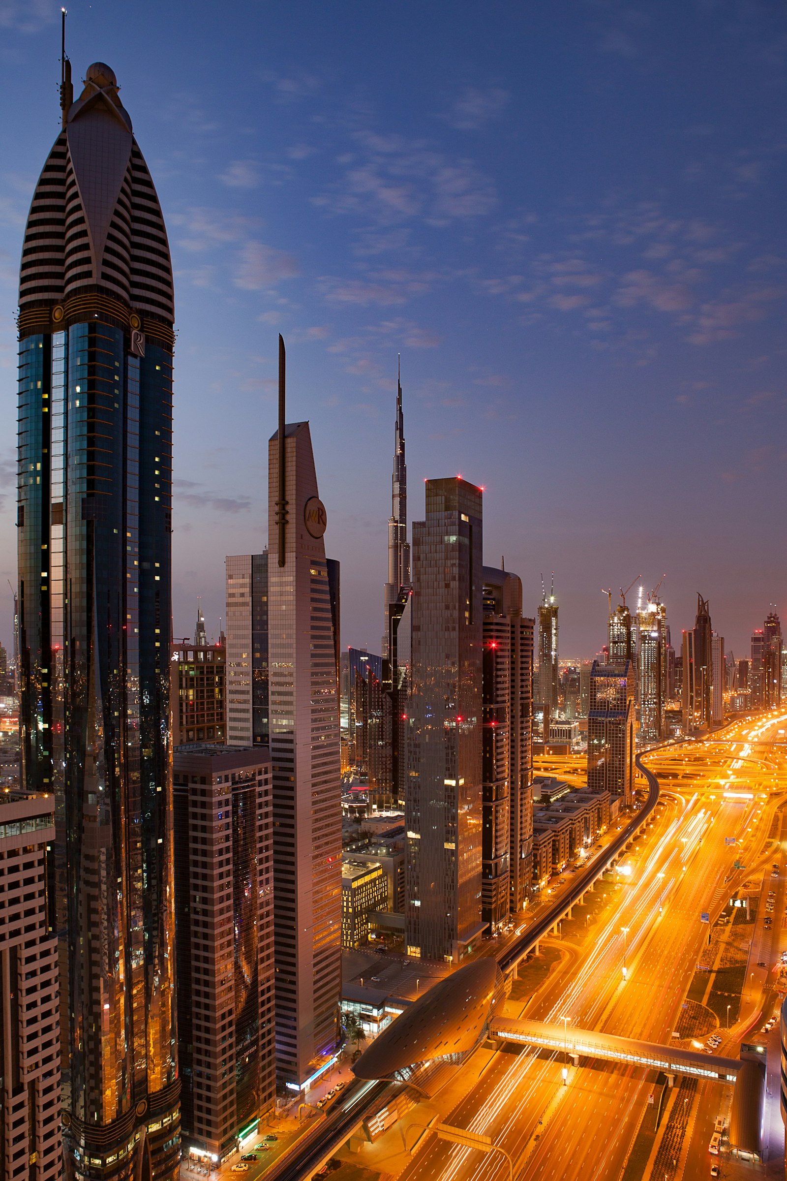 Illuminated Dubai skyline at night